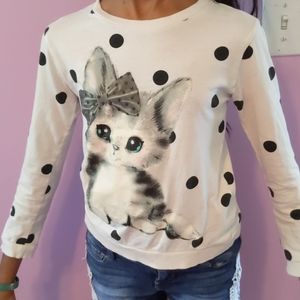 Polka dotted white top with cat